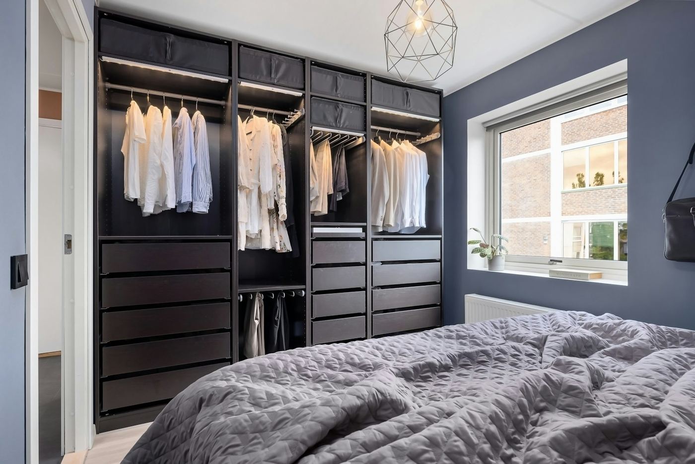 Example of the fitted wardrobe style we design and build, available across Manchester
