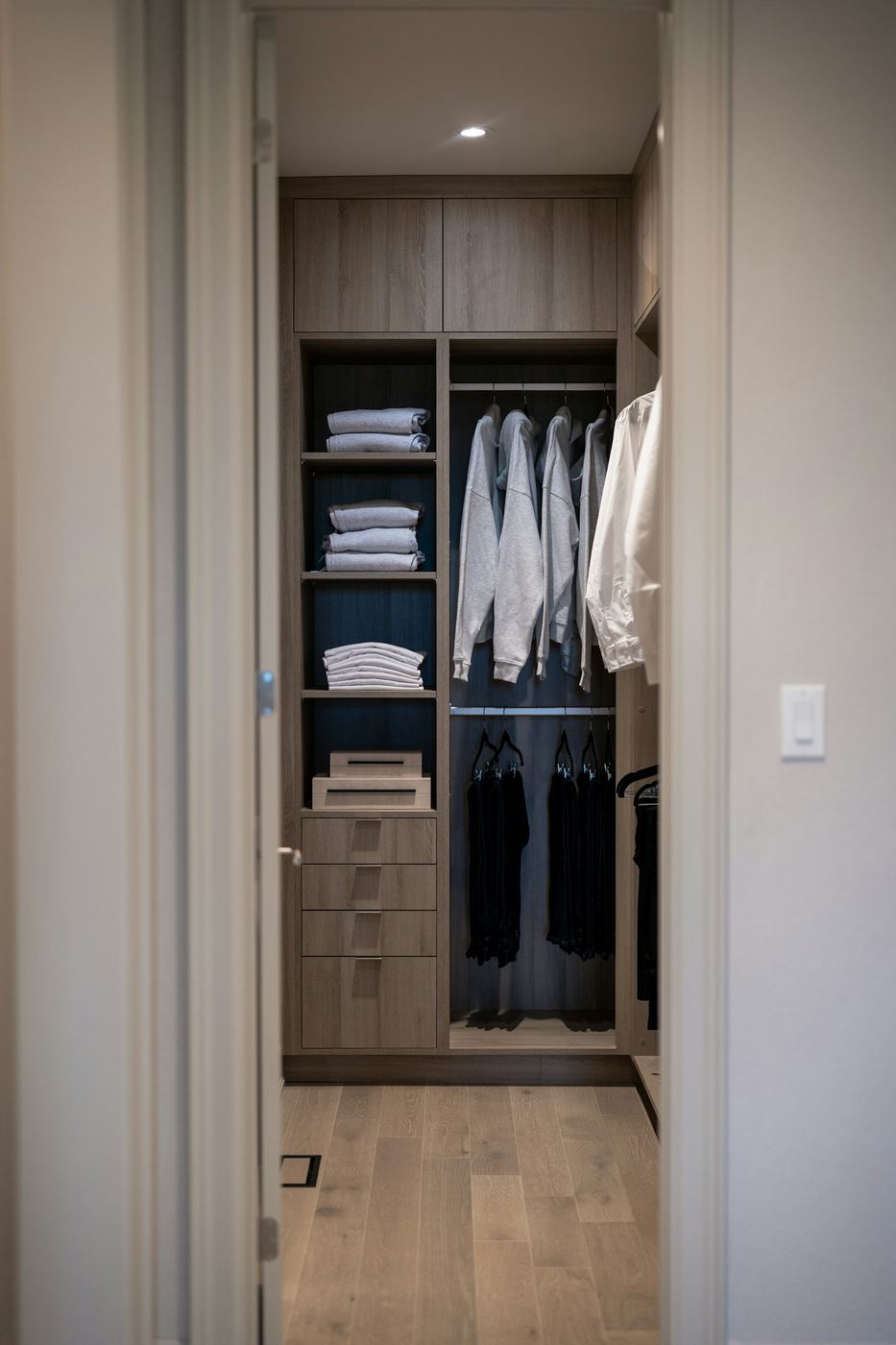 The Mayfair — handleless floor-to-ceiling fitted wardrobes with a full-height hanging and shelving layout