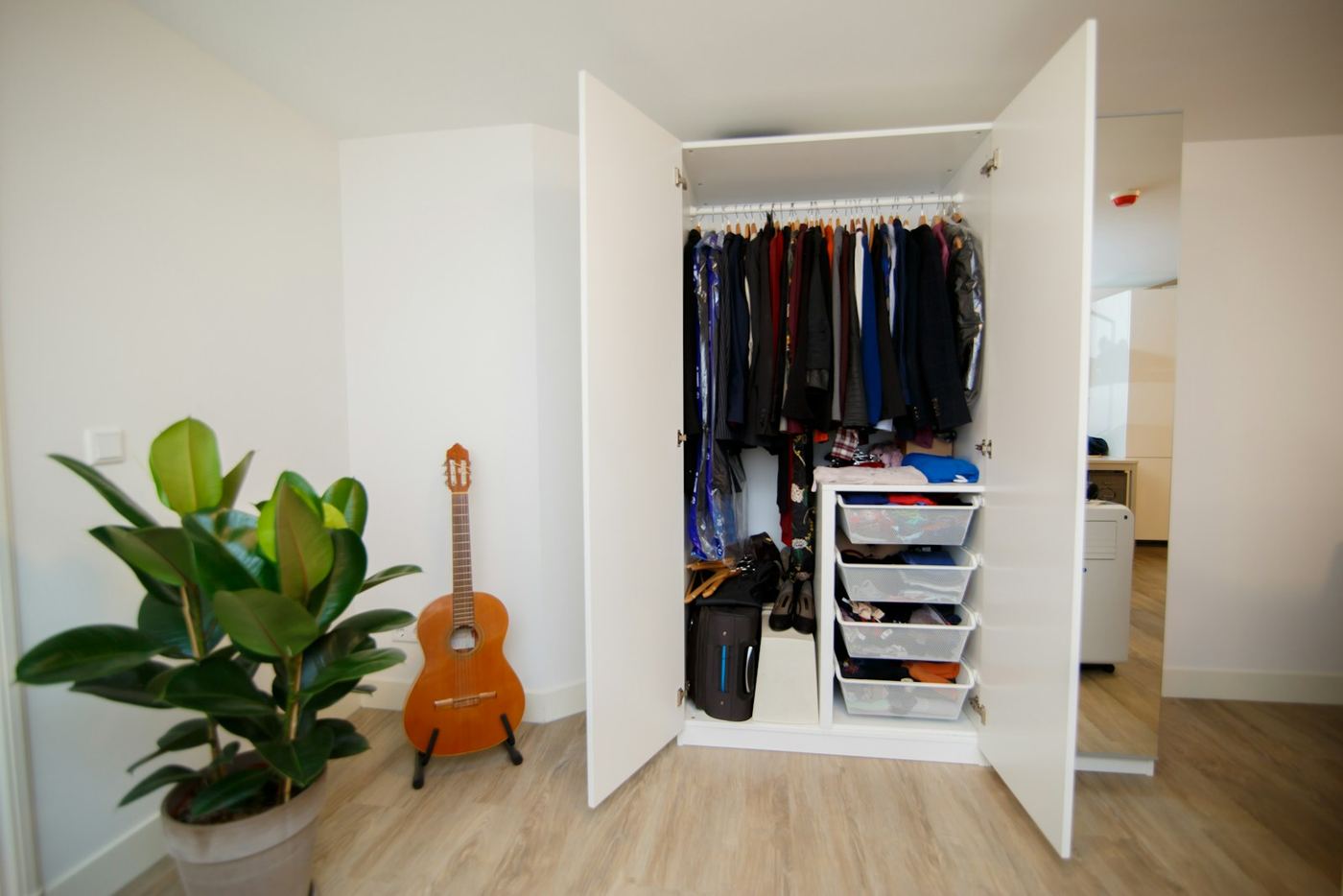 Example of the fitted wardrobe style we design and build, available across Stockport